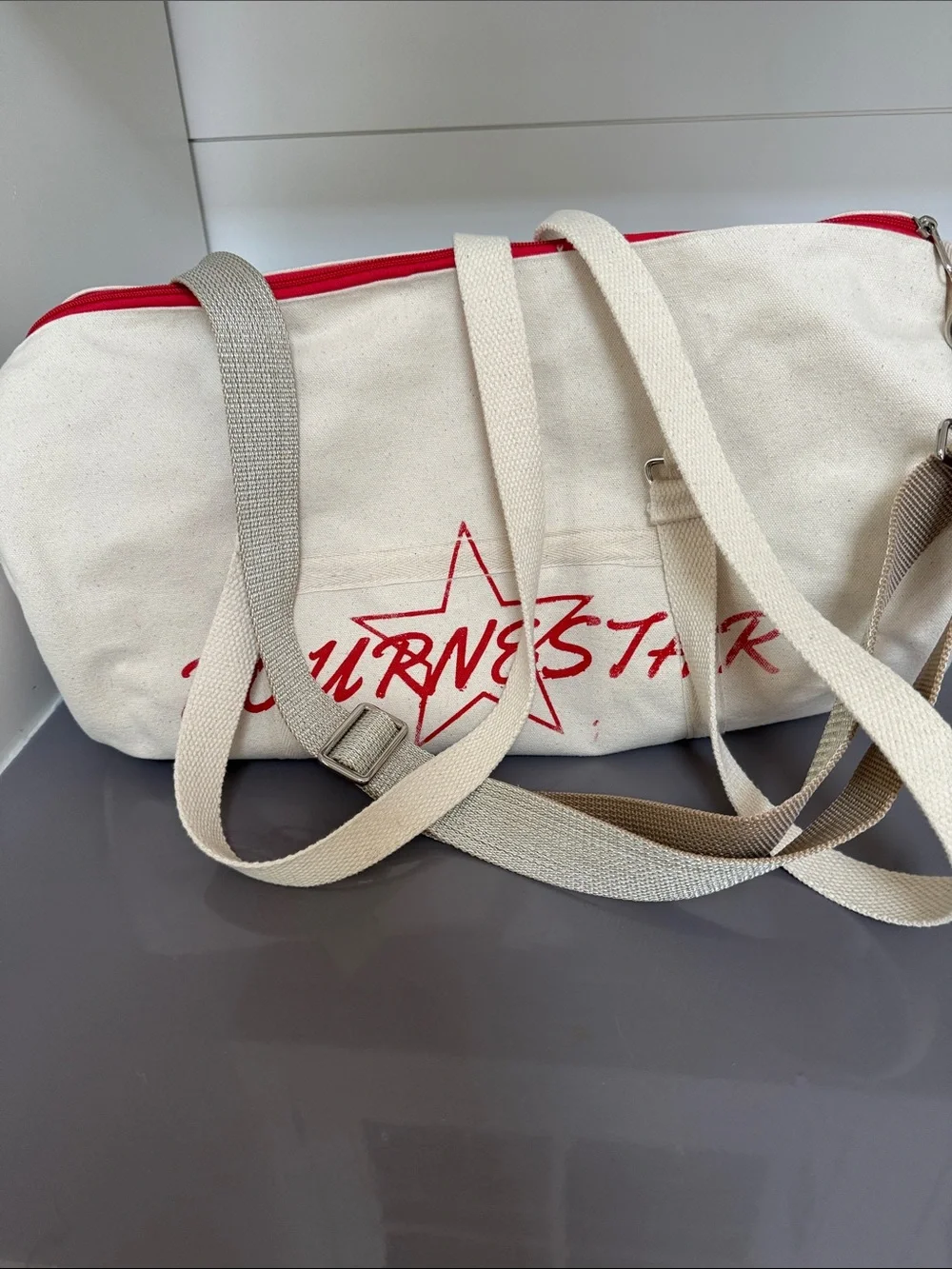 Bourne Star Canvas Duffel Bag in Cream with Red Accents
